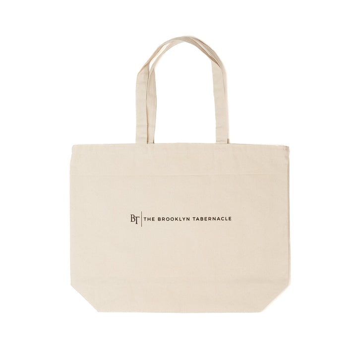 Beige tote bag with 'The Brooklyn Tabernacle' logo on a white background