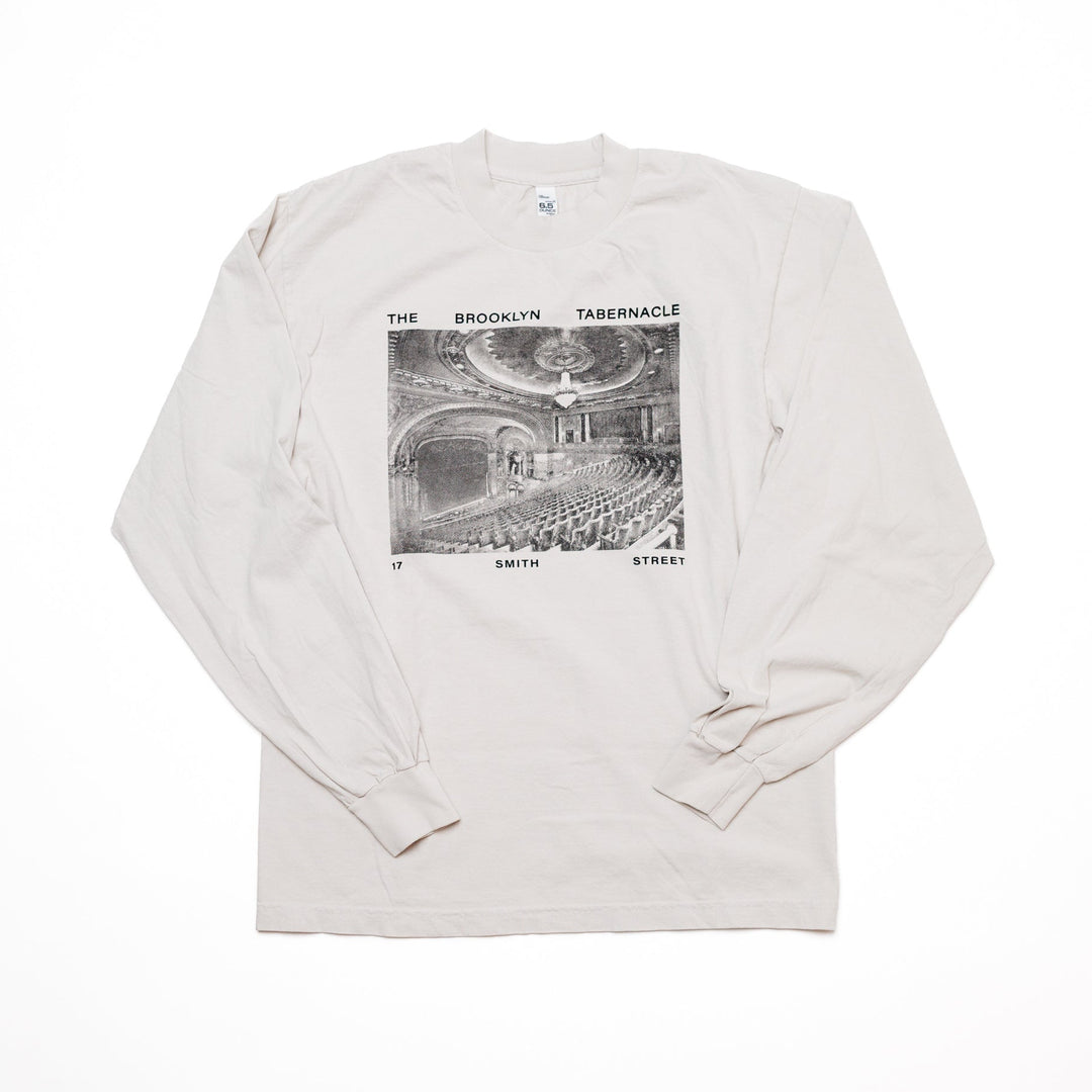 White long-sleeve shirt with black and white vintage graphic design of 17 Smith St theater.
