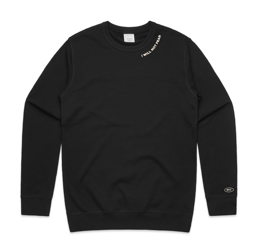 Black sweatshirt with "I WILL NOT FEAR" on the collar and "BTC" text on the sleeve